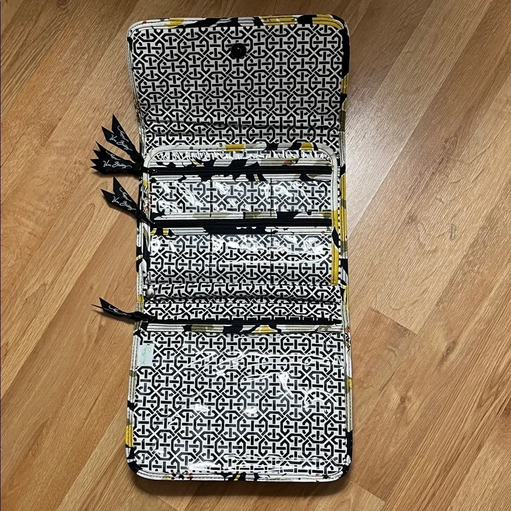 Vera Bradley travel case. Clear pouches inside for storage.